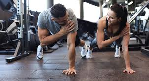 Toning Bingo Wings: Your Ultimate Guide to Sculpting Sleek Arms at the Gym 3 Fitness trainer demonstrating arm toning exercises Essex