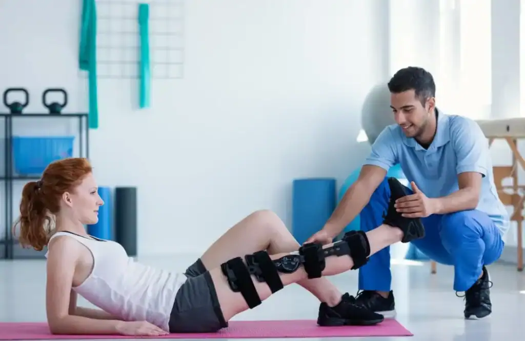 Woman having treatment to help muscle recovery Essex after an injury